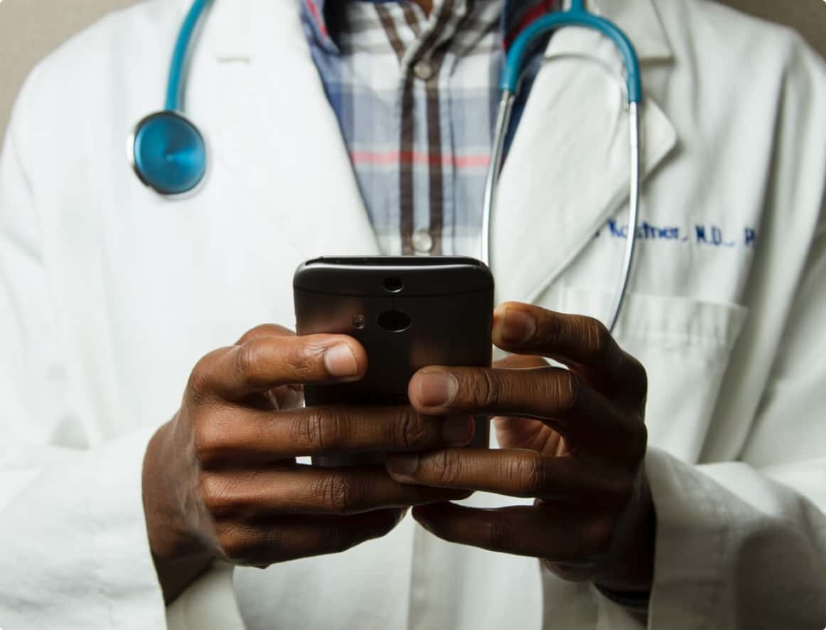 healthcare advisor or doctor using a cellphone.